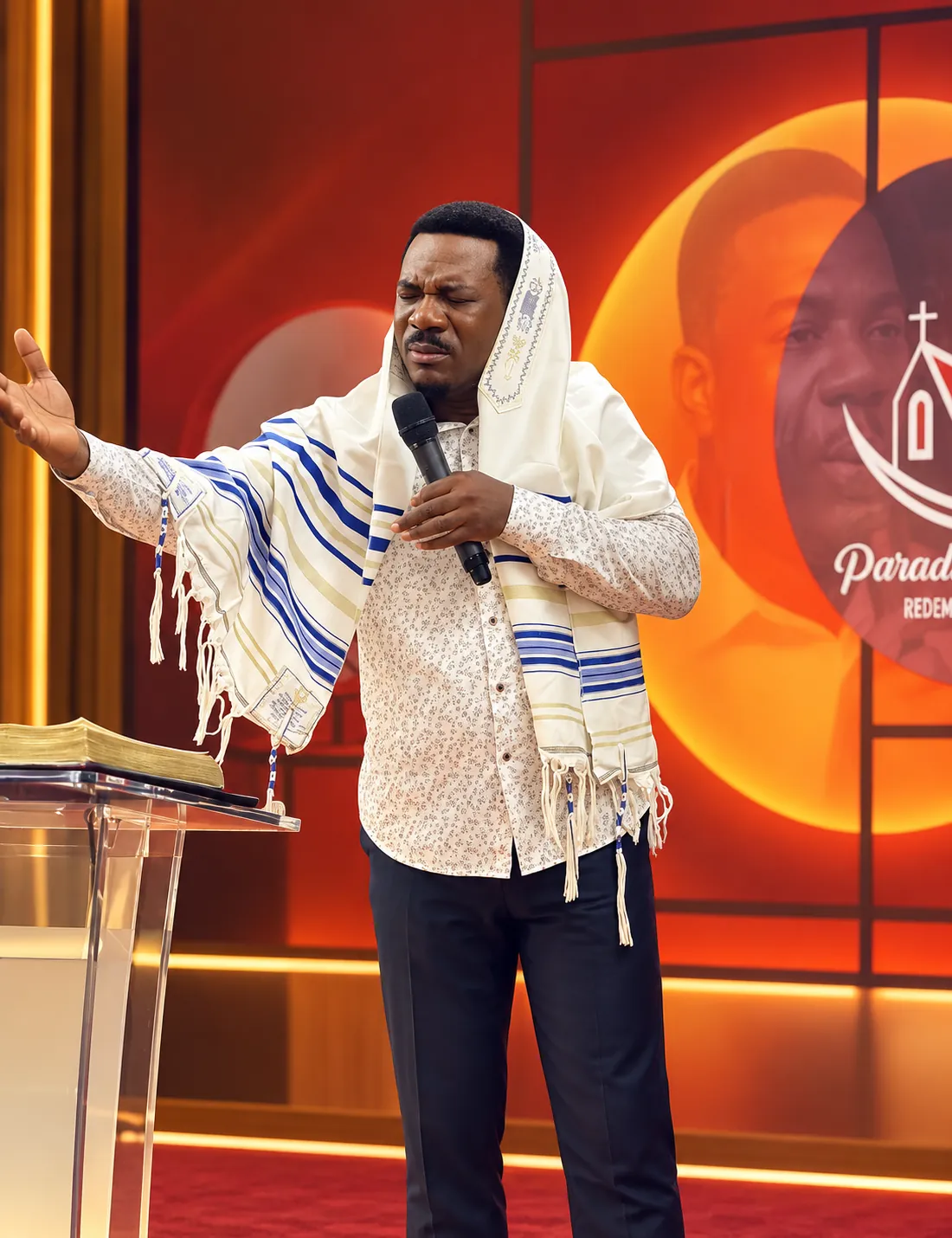 Pastor leading a moment of prayer at Precious Paradise Chapel